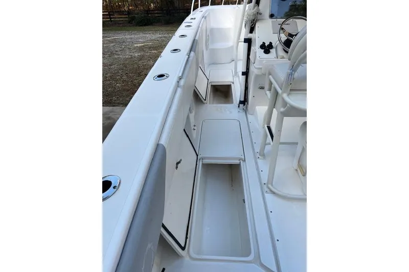 Slide: The Image of 2006 Fountain 38 Tournament Edition boat interior with storage compartments and seating. - 8