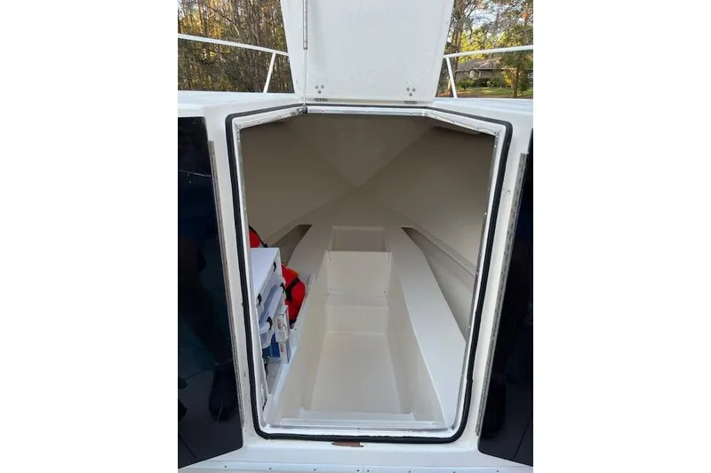 Slide: The Image of 2006 Fountain 38 Tournament Edition boat cabin interior with storage compartments. - 9