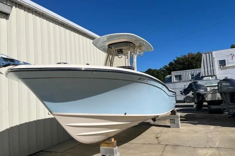 Slide: The Image of 2022 Grady-White Fisherman 236 boat displayed outdoors on blocks. - 0