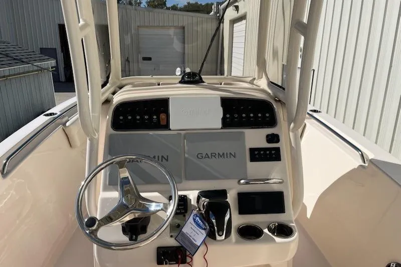 Slide: The Image of 2022 Grady-White Fisherman 236 boat dashboard with Garmin navigation system. - 3