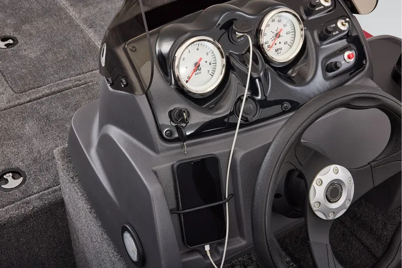 Slide: The Image of Manufacturer Provided Image: 2026 Tracker Super Guide V-16 SC dashboard with gauges and steering wheel. - 16