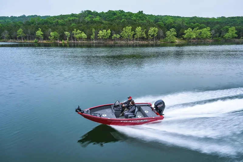Slide: The Image of Manufacturer Provided Image: 2026 Tracker Super Guide V-16 SC boat speeding on a serene lake. - 33