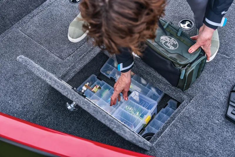 Slide: The Image of Manufacturer Provided Image: Person organizing tackle box on 2026 Tracker Super Guide V-16 SC boat. - 35