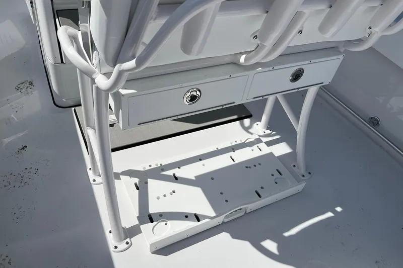 Slide: The Image of 2026 Sportsman Heritage 231 Center Console boat interior with storage compartments. - 10