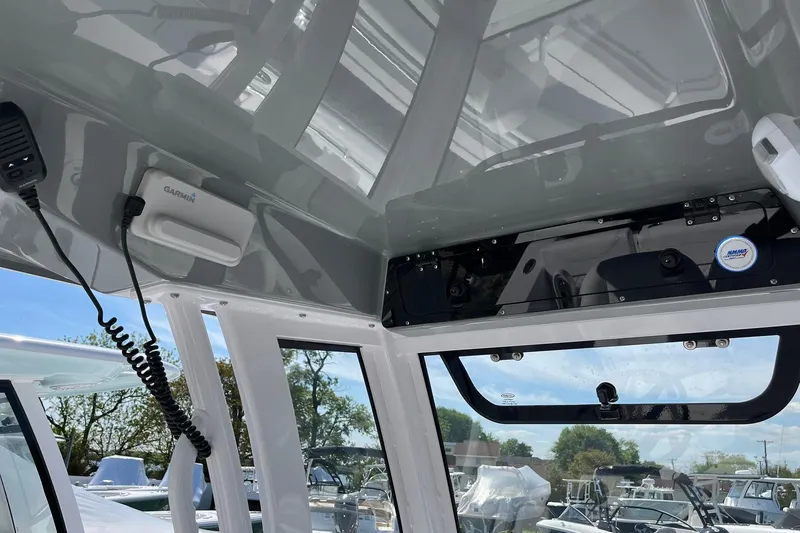 Slide: The Image of Interior view of 2026 Sportsman Heritage 231 Center Console boat with Garmin equipment. - 13