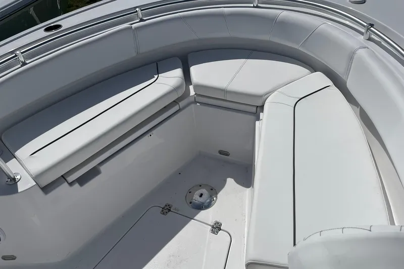 Slide: The Image of 2026 Sportsman Heritage 231 Center Console boat interior with cushioned seating. - 15