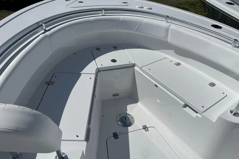 Slide: The Image of 2026 Sportsman Heritage 231 Center Console boat interior with seating and storage compartments. - 16