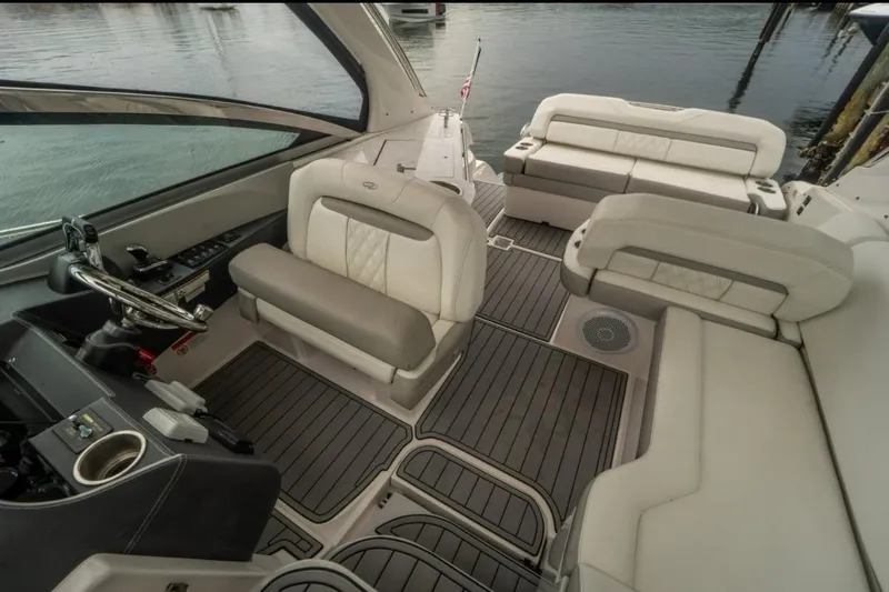 Slide: The Image of 2021 Regal 33 OBX boat interior with luxurious seating and modern helm design. - 6