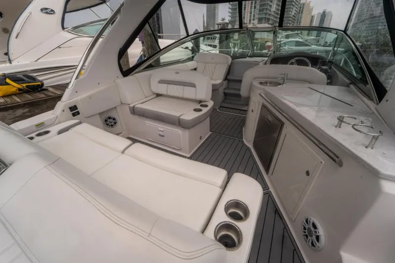 Slide: The Image of 2021 Regal 33 OBX boat interior with luxurious seating and modern amenities. - 7