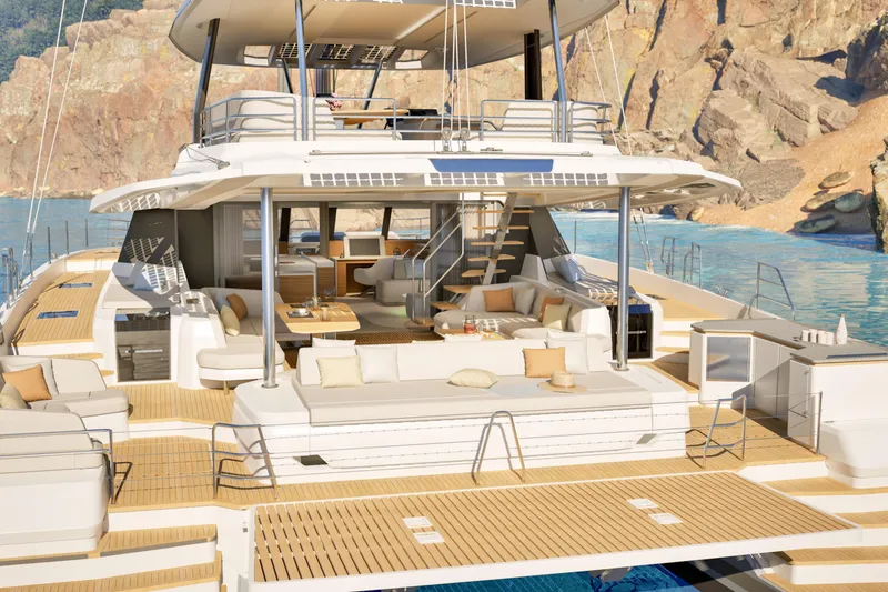 Slide: The Image of Luxurious 2027 Fountaine Pajot 70 S yacht with spacious deck and elegant seating area. - 11