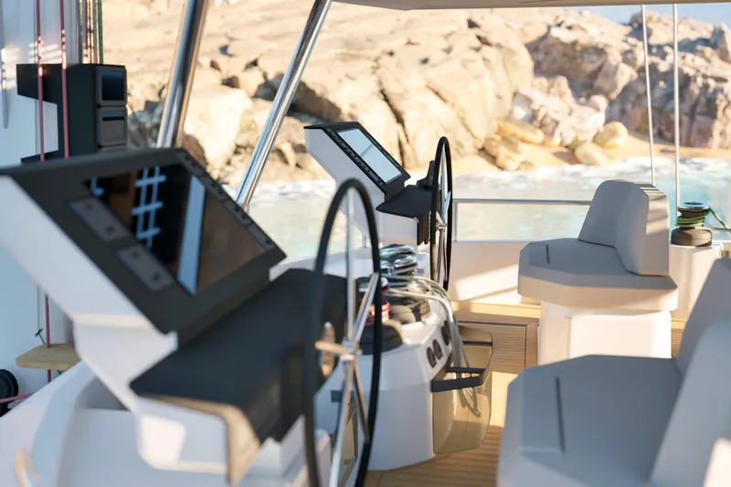 Slide: The Image of Interior view of 2027 Fountaine Pajot 70 S yacht cockpit with modern controls. - 16