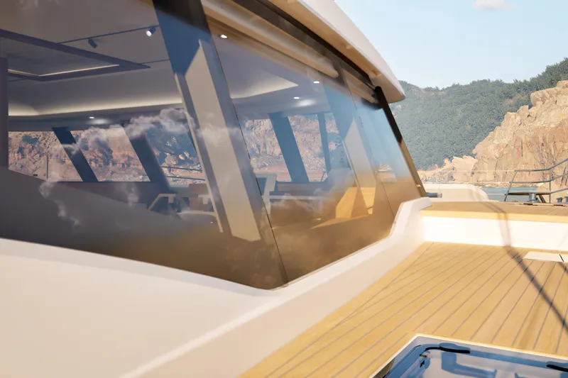 Slide: The Image of Luxurious 2027 Fountaine Pajot 70 S yacht with sleek design and scenic backdrop. - 24