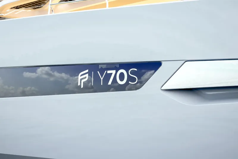 Slide: The Image of 2027 Fountaine Pajot 70 S yacht logo on sleek hull design. - 9