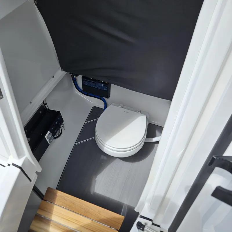 Slide: The Image of 2019 Blackfin 222 CC boat interior with compact marine toilet. - 19