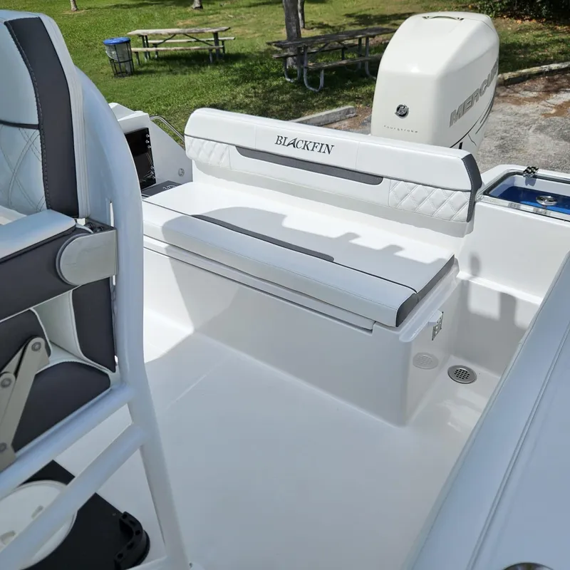 Slide: The Image of 2019 Blackfin 222 CC boat interior with seating and Mercury engine. - 20