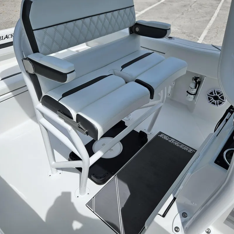 Slide: The Image of 2019 Blackfin 222 CC boat seating with cushioned bench and armrests. - 5