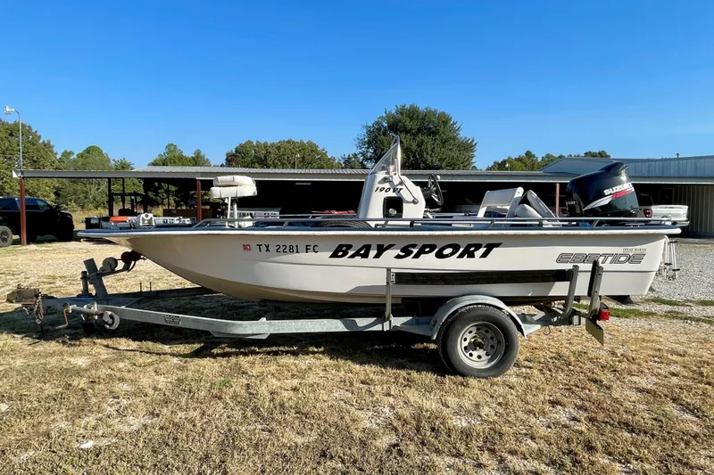 Slide: The Image of 1997 Ebbtide 190 SV Bay Sport boat on trailer, parked outdoors. - 1