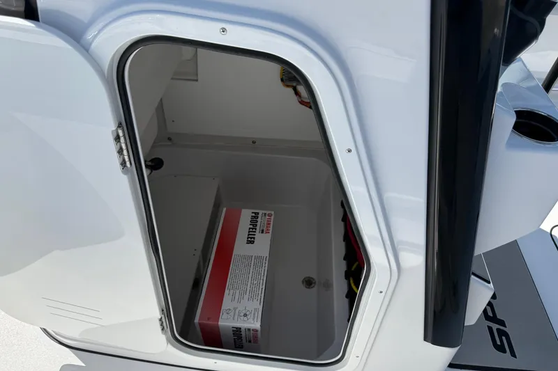 Slide: The Image of Open storage compartment on 2026 Sportsman Open 232 Center Console boat with propeller box inside. - 12