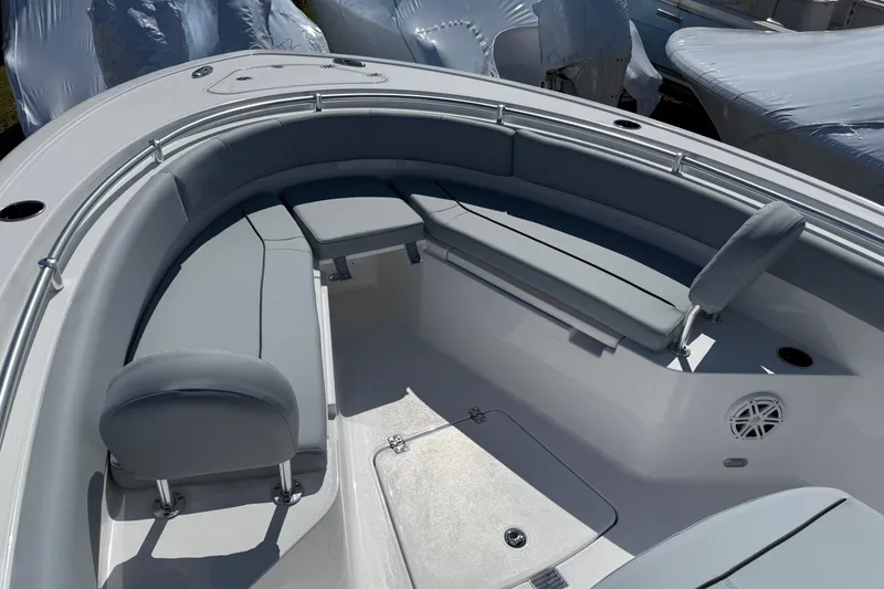 Slide: The Image of 2026 Sportsman Open 232 Center Console boat with cushioned seating and sleek design. - 15