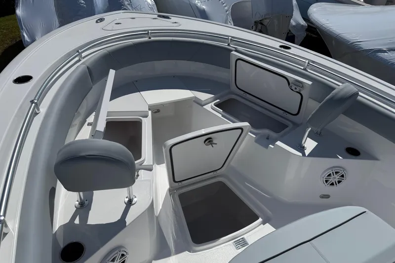 Slide: The Image of 2026 Sportsman Open 232 Center Console boat interior with storage compartments and seating. - 16