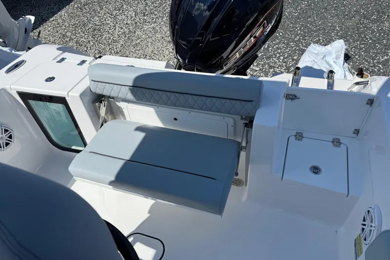 Slide: The Image of 2026 Sportsman Open 232 Center Console boat interior with seating and storage compartments. - 4