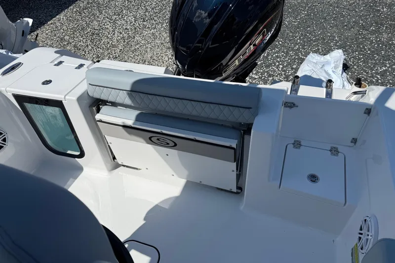 Slide: The Image of 2026 Sportsman Open 232 Center Console boat interior with seating and storage compartments. - 5