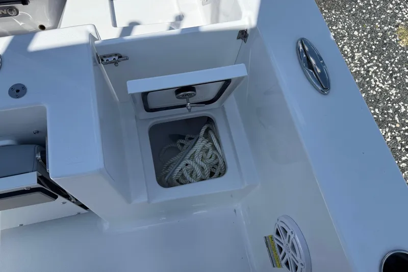 Slide: The Image of 2026 Sportsman Open 232 Center Console boat with rope storage compartment. - 6