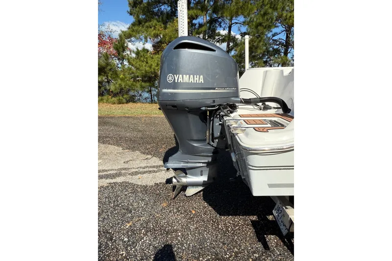 Slide: The Image of 2018 Sea Fox 248 Commander with Yamaha outboard motor, parked on a sunny day. - 18