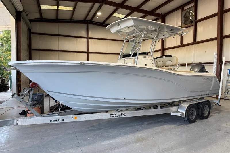Slide: The Image of 2018 Sea Fox 248 Commander boat on trailer in a warehouse setting. - 20