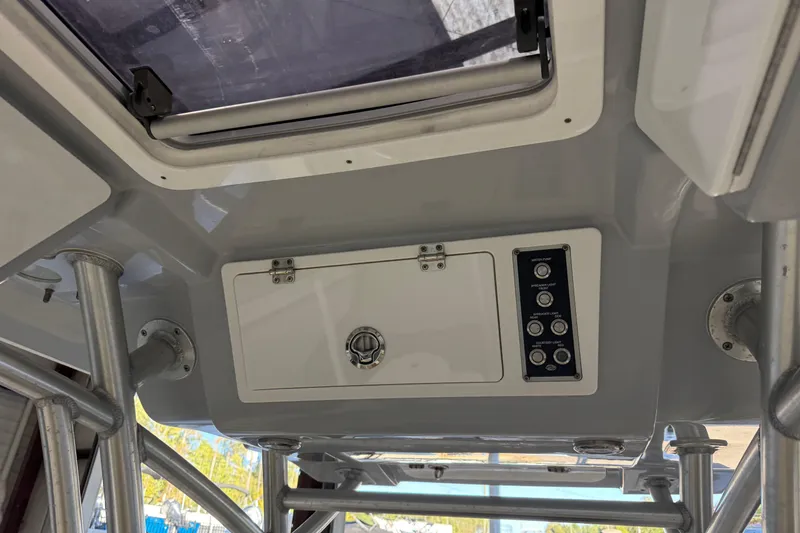 Slide: The Image of 2018 Sea Fox 248 Commander boat console with control panel and storage compartment. - 24