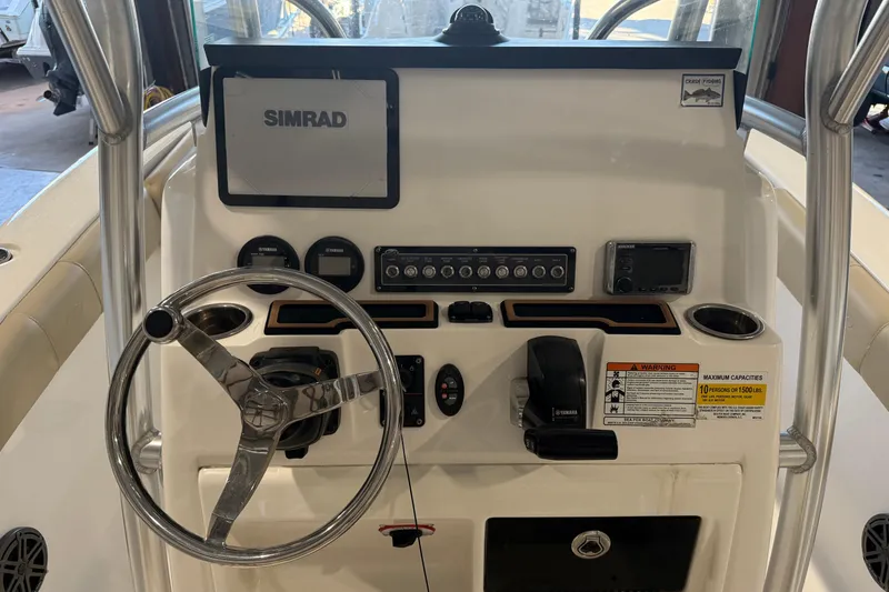 Slide: The Image of 2018 Sea Fox 248 Commander boat dashboard with steering wheel and control panel. - 26