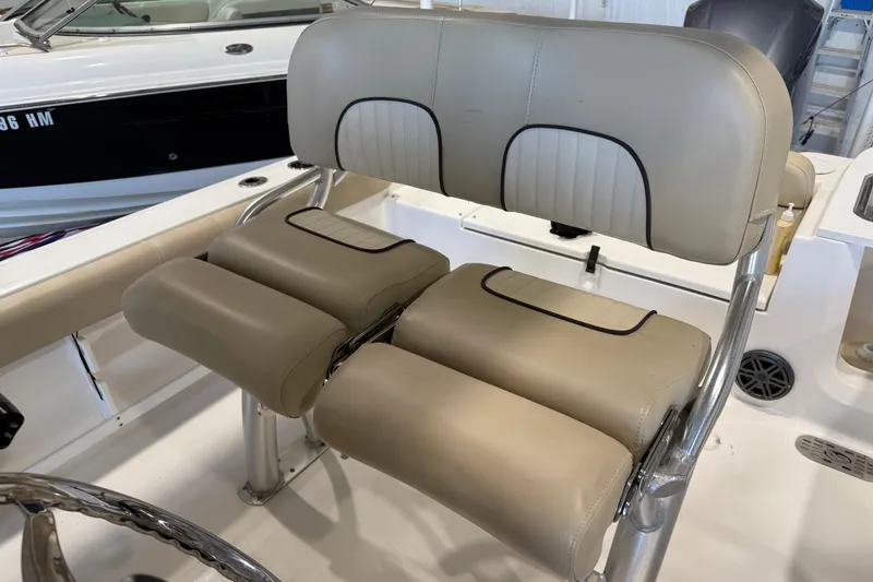 Slide: The Image of 2018 Sea Fox 248 Commander boat seat with beige upholstery and stainless steel frame. - 27