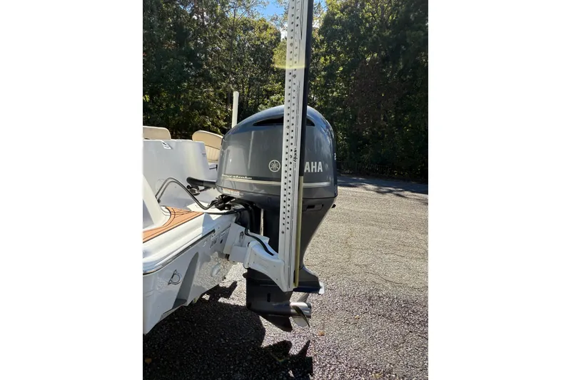 Slide: The Image of 2018 Sea Fox 248 Commander boat interior with cushioned seating and cup holders. - 6