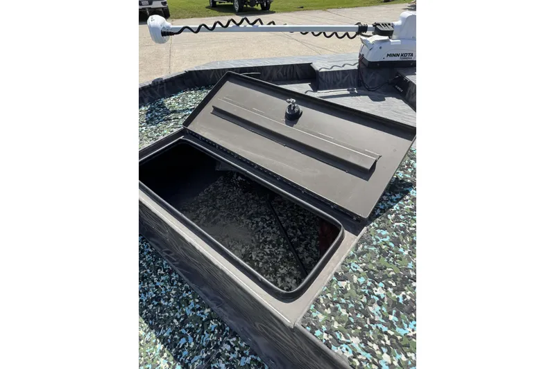 Slide: The Image of Open storage compartment on 2022 Alweld 2270 Large Flat Bottom boat with Minn Kota motor. - 14
