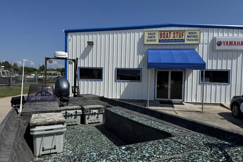 Slide: The Image of 2022 Alweld 2270 Large Flat Bottom boat outside marine supply store. - 3