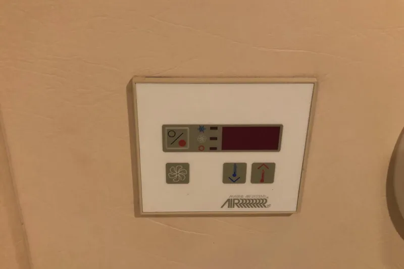 Slide: The Image of Control panel for air conditioning on a 1999 Mainship 31 Sedan Bridge yacht. - 21