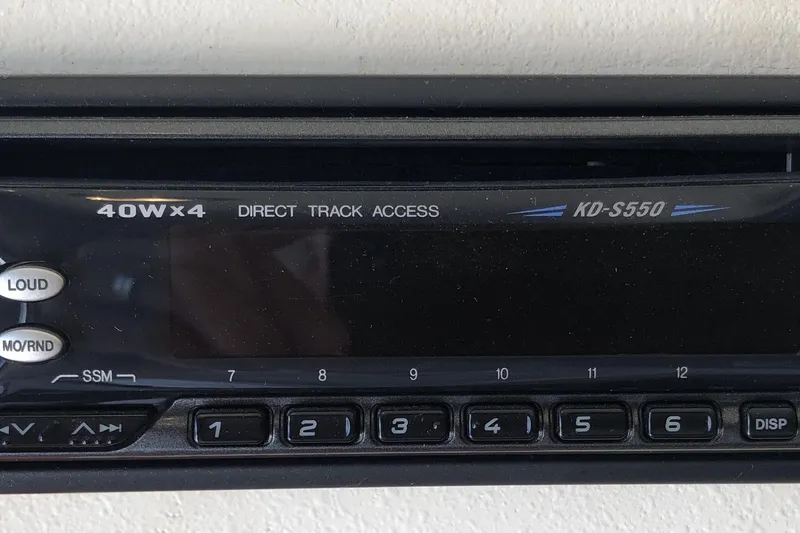 Slide: The Image of Close-up of a KD-S550 stereo system on a 1999 Mainship 31 Sedan Bridge. - 37