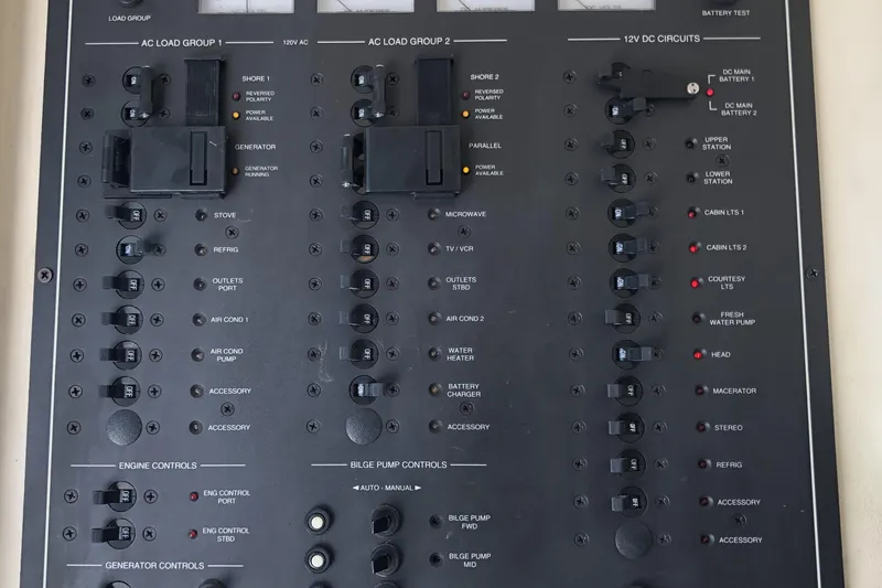Slide: The Image of Electrical control panel of a 1999 Mainship 31 Sedan Bridge boat. - 38