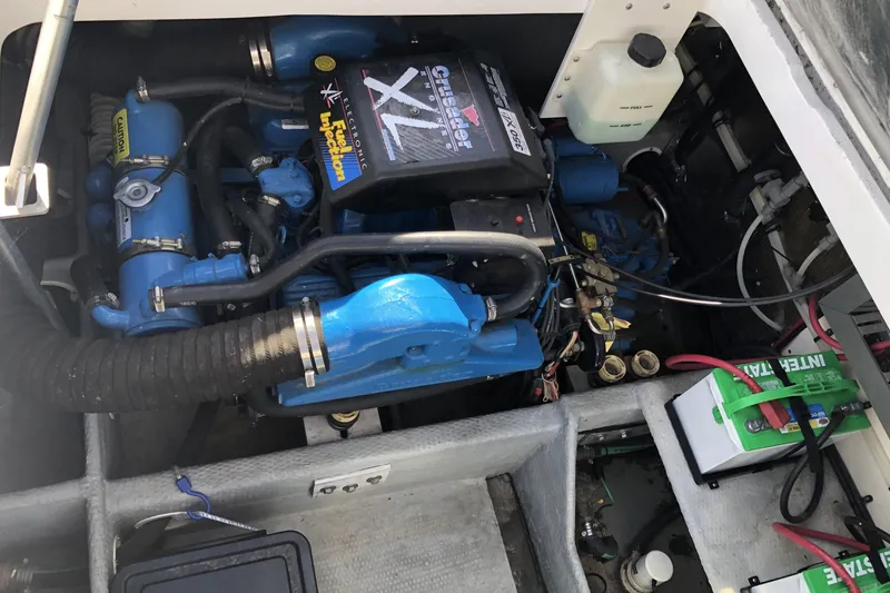 Slide: The Image of Engine compartment of a 1999 Mainship 31 Sedan Bridge with Crusader XL engine. - 40