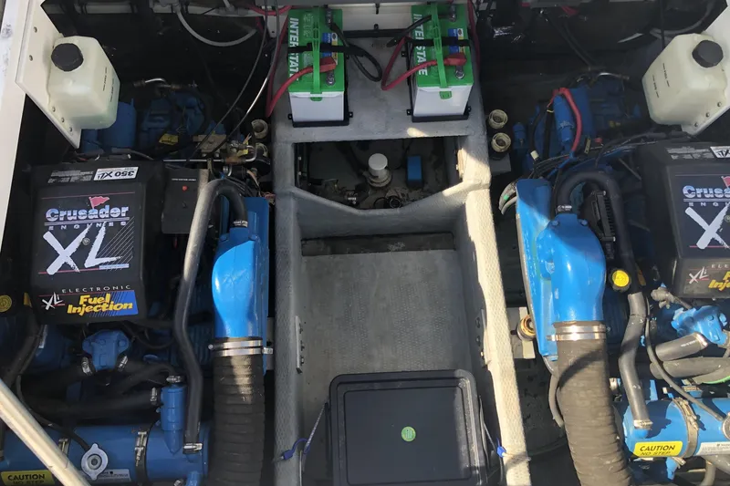 Slide: The Image of Engine compartment of 1999 Mainship 31 Sedan Bridge with Crusader XL engines. - 41