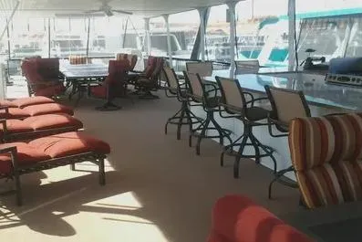 Slide: The Image of Spacious 2007 Sumerset Steelaway yacht deck with seating and dining area. - 2