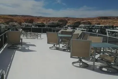 Slide: The Image of 2007 Sumerset Steelaway boat deck with tables and chairs, set against a scenic backdrop. - 6