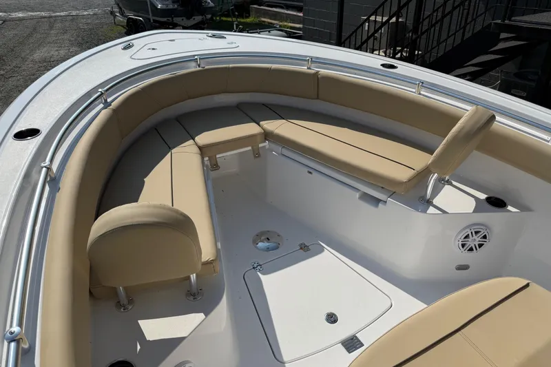 Slide: The Image of 2026 Sportsman Open 232 Center Console boat with tan seating and spacious deck. - 14