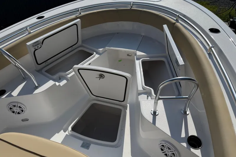 Slide: The Image of 2026 Sportsman Open 232 Center Console boat with open storage compartments and seating. - 15