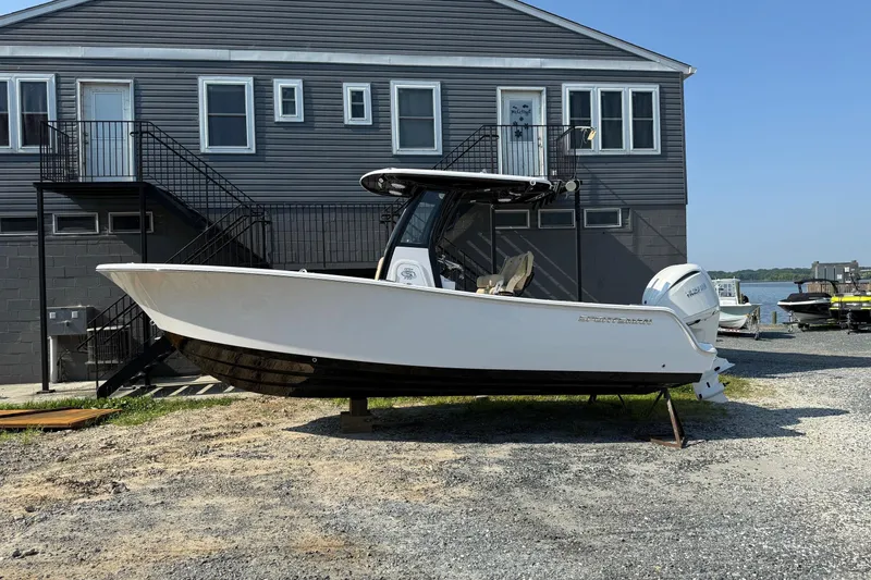Slide: The Image of 2026 Sportsman Open 232 Center Console boat on display outdoors. - 3