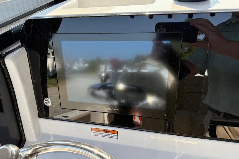 Slide: The Image of 2026 Sportsman Open 232 Center Console with Garmin display at helm. - 9