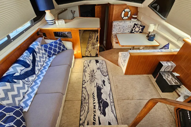 Slide: The Image of Interior of 1995 Carver 355 Aft Cabin Motor Yacht with nautical-themed decor. - 16