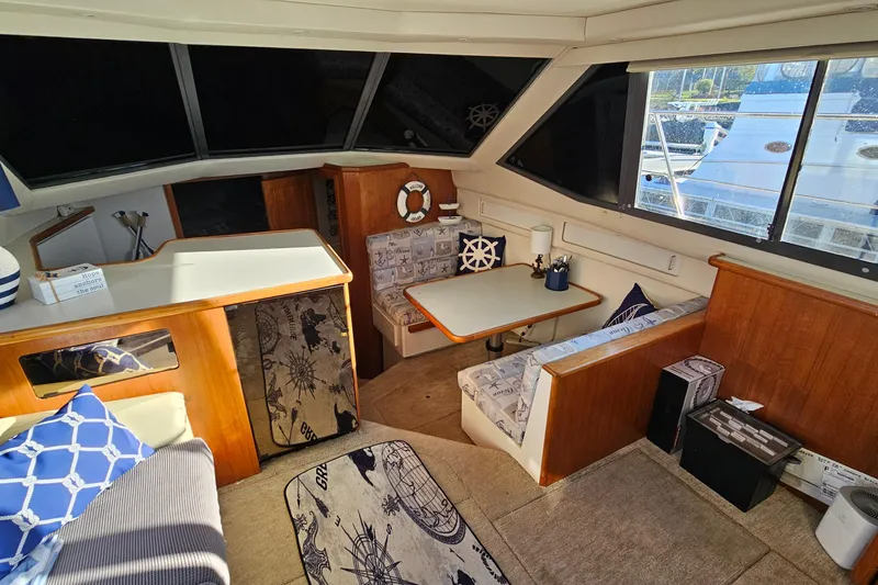 Slide: The Image of Interior of 1995 Carver 355 Aft Cabin Motor Yacht with nautical-themed decor. - 18