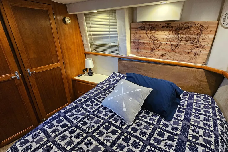 Slide: The Image of Cozy cabin interior of 1995 Carver 355 Aft Cabin Motor Yacht with nautical decor. - 27