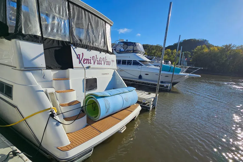 Slide: The Image of 1995 Carver 355 Aft Cabin Motor Yacht docked on a sunny day. - 5